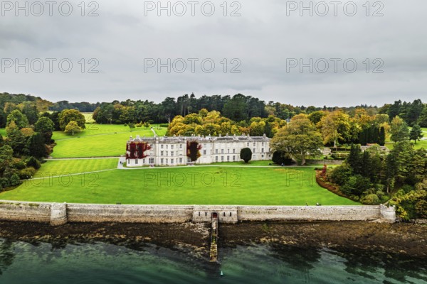 Autumn over Plas Newydd House from a drone, Gardens and Parkland, Llanfairpwllgwyngyll, Anglesey, Wales, UK