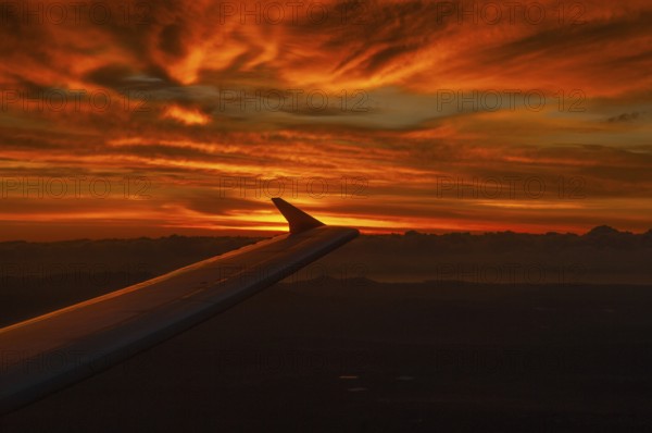 View from airplane window at sunrise