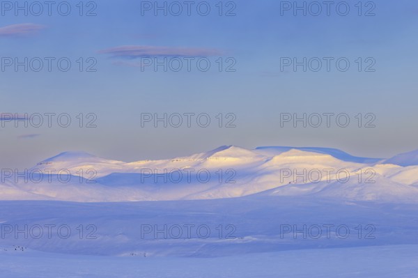 Snow covered mountains in Arctic landscape at Mohnbukta, bay at the western shore of Storfjorden in Sabine Land at Spitsbergen, Svalbard