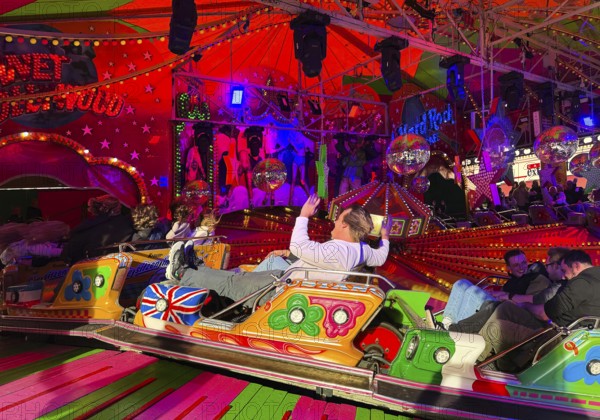 People on the Musik-Express ride at the All Saints Fair, the biggest old town fair in Europe, Soest, North Rhine-Westphalia, Germany