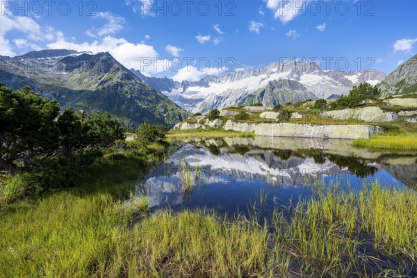 Picturesque mountain landscape, dammastock and damma glaciers reflected in Moorsee, Göscheneralp, Canton of Uri, Switzerland
