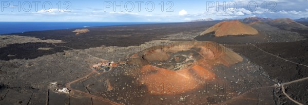 Montaña Quemada and Montaña Pedro Perico volcanoes, volcanic landscape with craters and lava fields, aerial view, Lanzarote, Canary Islands, Spain