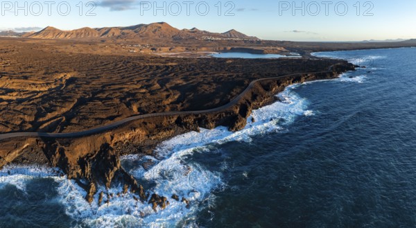 Coast with lava fields, volcanic landscape near Los Hervideros, in the evening light, aerial view, Lanzarote, Canary Islands, Spain