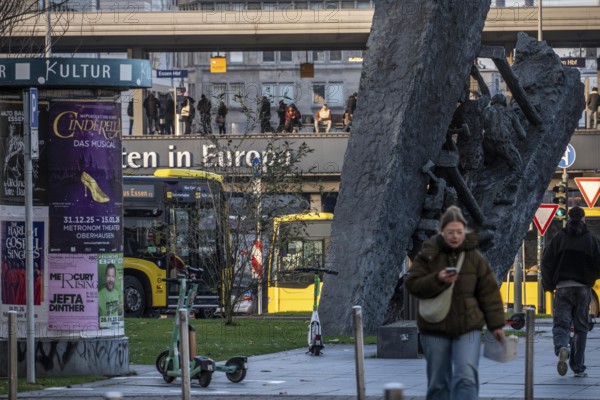 Downtown Essen, passers-by at Europaplatz, main train station, mining monument Steile Lagerung, North Rhine-Westphalia, Germany