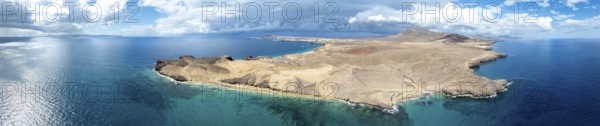 Headland and blue sea, coastal landscape, arid landscape of Los Ajaches Natural Park, aerial view, Lanzarote, Canary Islands, Spain