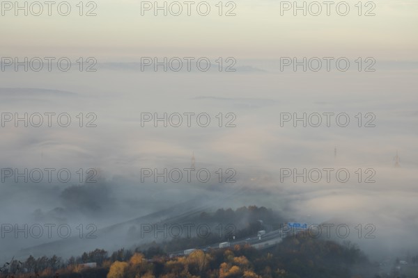 Aichelberg Alb climb of the A8 in thick fog on an autumn morning. Lkr. Göppingen, Baden-Württemberg, Germany