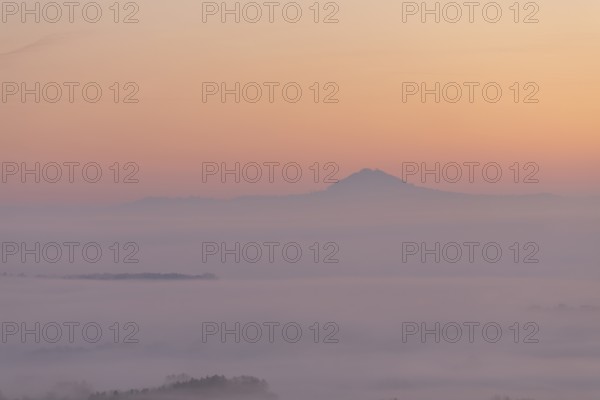 Hohenstaufen in the golden morning light, Aichelberg. Spectacular dawn over the foggy foothills of Alb