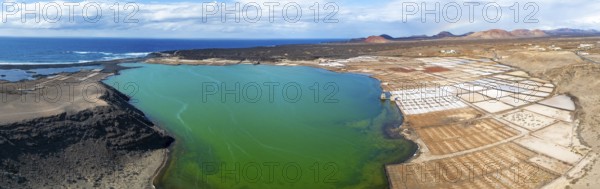 Salt mining plant, Salinas de Janubio with green Laguna de Janubio, near Yaiza, aerial view, Lanzarote, Canary Islands, Spain