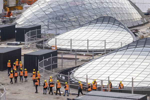Stuttgart Central Station. Stuttgart 21 construction site. The new transit station is being built here. Light eyes on the roof of the new train station. Bonatz building. Construction site tour with a group of visitors. Stuttgart, Baden-Württemberg, Germany
