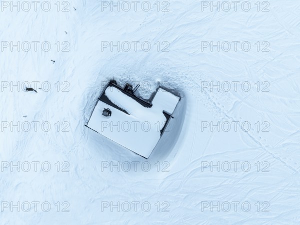 Wonderful winter landscape with Hohe Salve, blue sky and snow, mountains and mountain valley, aerial view of Skiwelt Wilder Kaiser ski area, Brixental, Tyrol, Austria