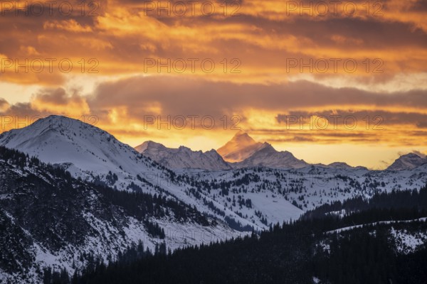 Grossglockner peaks at sunset in winter, spectacular cloudy skies, Hochbrixen, Brixen im Thale, Tyrol, Austria