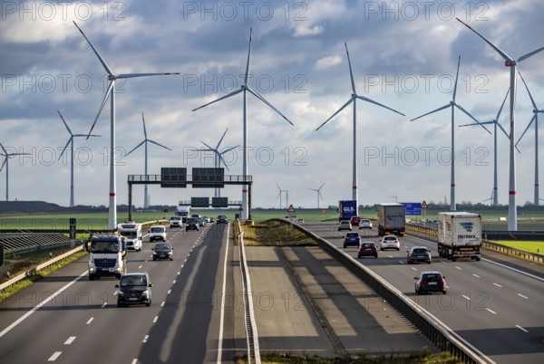 A44 motorway near Bedburg, in front of the Jackerath triangle, recultivated open-cast mining site, Garzweiler open-cast lignite mine, Königshovener Höhe wind farm near Bedburg, operated by RWE and the city of Bedburg, North Rhine-Westphalia, Germany