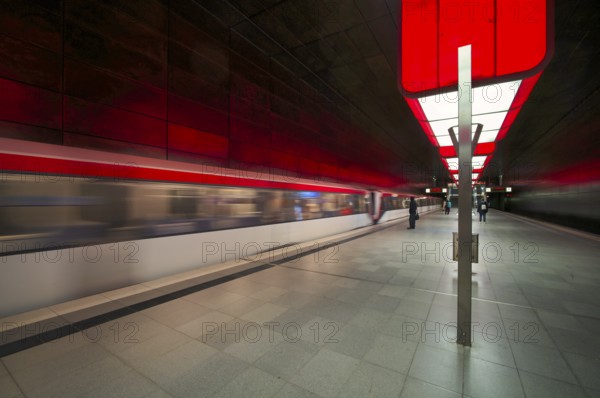 HafenCity University subway station, illuminated in color, red, underground train, movement effect, U4, travelers, platform, stop, train station, subway, public transport, HVV, Hamburger Verkehrsverbund, Hochbahn, public transport, Free and Hanseatic City of Hamburg, Germany