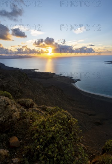 View of steep cliffs on sea and coast, Mirador del Porrito viewpoint at sunset, Lanzarote, Canary Islands, Spain