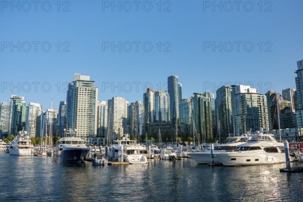 Sailing boats in marina, skyscrapers on the promenade, Coal Harbour, Vancouver, British Columbia, Canada