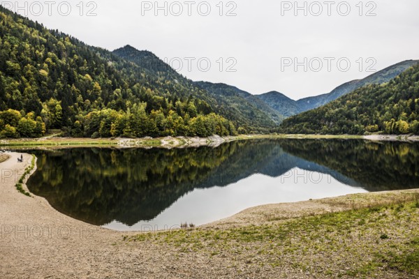 Picturesque mountain lake with water reflections in autumn, Lac de Kruth-Wildenstein, Kruth, Vosges, Alsace-Lorraine, Department of Vosges Haut-Rhin, France