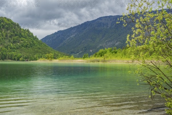 Landscape of Lake Offensee after rain when the sun comes through the clouds in spring, Salzkammergut, Austria