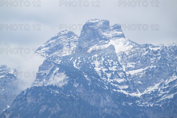 View into the mountains next to Lake Almsee on a rainy day in spring, Traunstein summit, Traunkirchen, Salzkammergut, Austria