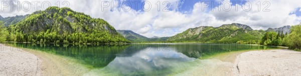 Landscape of Lake Offensee after rain when the sun comes through the clouds in spring, Salzkammergut, Austria