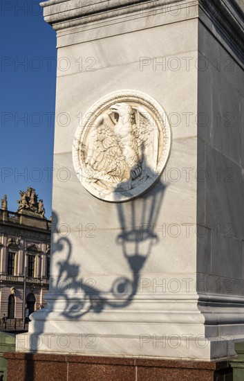 The shadow of a street lamp on the pedestals of the group of figures on the Schlossbrücke, Unter den Linden, Berlin, Germany