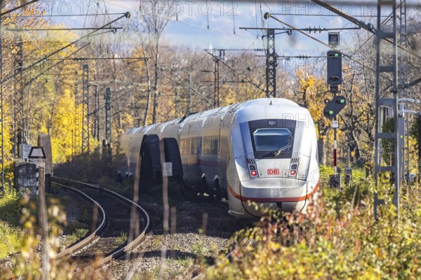 Intercity Express ICE. Open-route passenger train in the Stuttgart North Station area. Arched bridge and landscape in autumn. Stuttgart, Baden-Württemberg, Germany