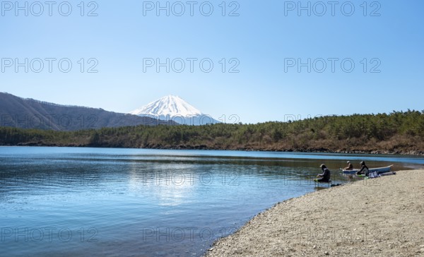 Anglers at Lake Saiko, behind volcano Mt. Fuji, Minamitsuru District, Yamanashi Prefecture, Japan