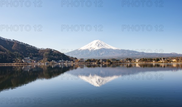Volcano Mt. Fuji is reflected in Lake Kawaguchi, Yamanashi Prefecture, Japan