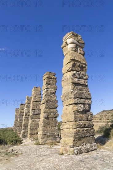 Stone columns of ancient aqueduct, Roman site of Los Banales, near Layana, Zaragoza province, Aragon, Spain