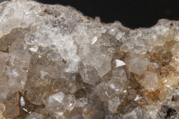 Vibrating quartz crystals mix with rock formations and capture light in a natural spring atmosphere. Geological diversity attracts the interest of enthusiasts