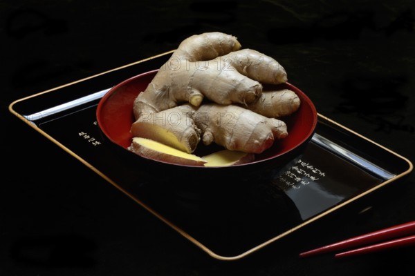 Ginger, ginger root in tea bowl, Zingiber officinale, tea preparation
