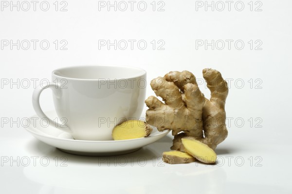 Ginger root with cup, ginger tea