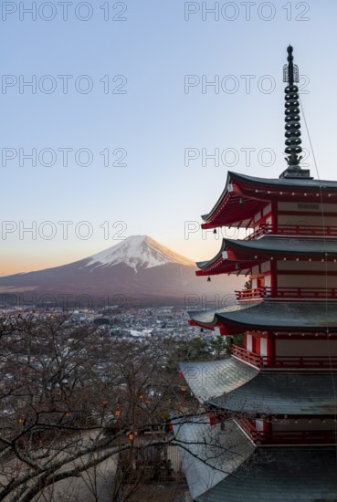 Five-story pagoda of a Shinto Shrine, Chureito Pagoda, with views of Fujiyoshida City and Mount Fuji volcano at sunset, Arakura Fuji Sengen Shrine, Arakurayama Sengen Park, Yamanashi Prefecture, Japan