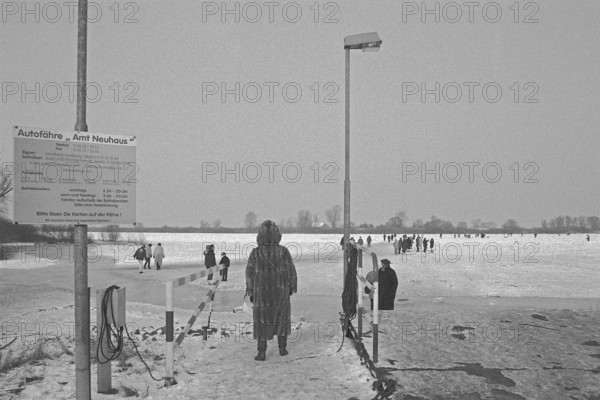 Ferry dock, people walk across ice rink, frozen Elbe, Bleckede, Lower Saxony, Germany, February 9, 1996, vintage, retro, old, historic
