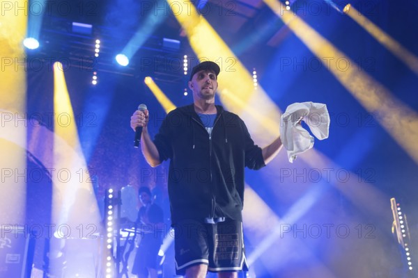 Carlito (Carlos Charlemoine), singer of Irie Révoltés live on Irieunion - Le Re-Tour pour une année! Tour in Berlin's Columbiahalle on 31.10.2025