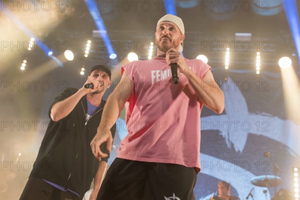 Carlito (Carlos Charlemoine) and Mal Élevé (Pablo Charlemoine), singers from Irie Révoltés live on Irieunion - Le Re-Tour pour une année! Tour in Berlin's Columbiahalle on 31.10.2025