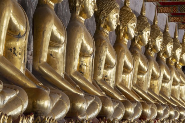 Gilded Buddha statues (Bhumispara mudra: Buddha Gautama at the moment of enlightenment), Wat Suthat Thepwararam, Royal Temple, Phra Nakhon, Bangkok, Thailand