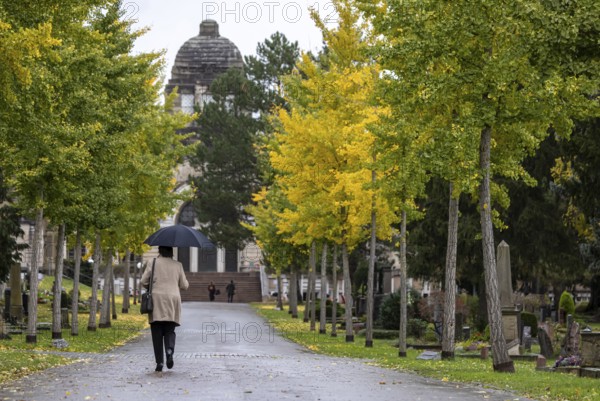 Pragfriedhof Stuttgart in autumn. November is traditionally a time for Christians to visit their graves. Symbolic photo with graves and grave decorations. Stuttgart, Baden-Württemberg, Germany