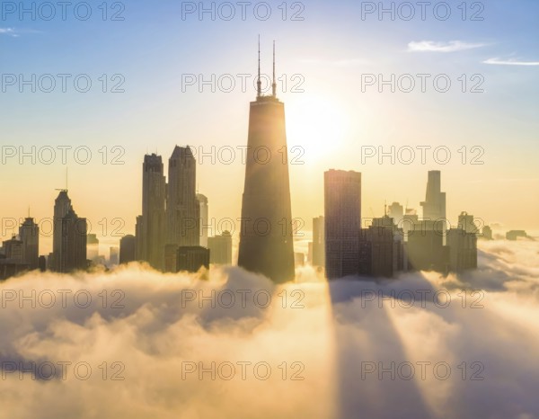 City scape emerging from a dense enveloping fog in sunrise and skyscrapers piercing the haze, big metropolis with skyline, mist on ground, blue sky, city in an aerial view, AI generated