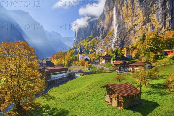 View of town and valley with Staubbach waterfall in autumn, Lauterbrunnen, Bernese Oberland, Canton of Bern, Switzerland