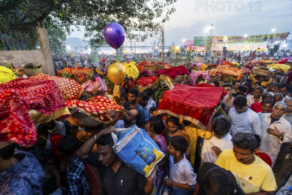 Hindu devotees gather on the banks of the Brahmaputra River to offer prayers to the Sun God on the occasion of Chhath Puja, in Guwahati, India on 27 October 2025