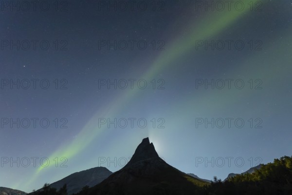 National mountain of Norway - Stetind in the Nordland under auroras and a full moon