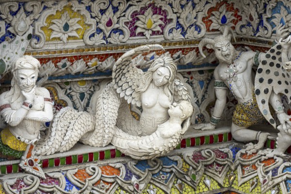 Decorative elements with pop culture references (for example comics, superheroes) in the stucco and porcelain vases outside and inside the art hall with modern art trends such as minimalism and abstraction, Wat Pariwat, Yan Nawa district, Bangkok, Thailand