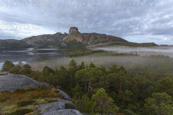 Magical morning fog on Steigtindvatnet in front of the majestic Steigtinden in Norway near Bodø