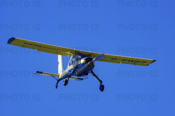 A PZL-104 Wilga-35A sport aircraft from Fliegerklub Kamenz with registration D-EWRZ during a flight demonstration as part of an air show on Rossfeld in Metzingen-Glems, Baden-Württemberg, Germany, for editorial use only