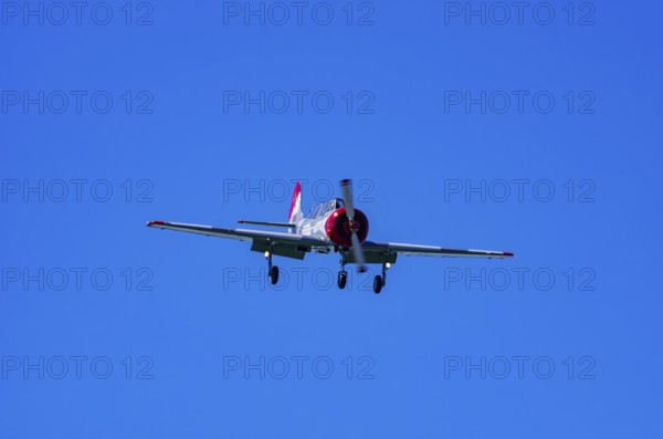 A Jakovlev Jak-52 with registration LY-HLZ during a flight demonstration as part of an air show on Rossfeld in Metzingen-Glems, Baden-Württemberg, Germany, for editorial use only