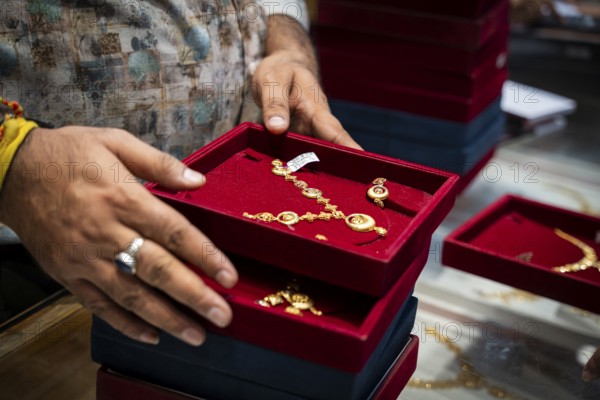 Customers purchase Gold jewelry at a store on the occasion of the festival of Dhanteras, in Guwahati, Assam, India on 18 October 2025. People rushing to buy gold even after its nearly 60% surge to record highs this year