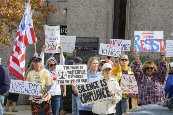 Detroit, Michigan USA - 18 October 2025 - Protesters from Detroit and Grosse Pointe gathered on the border between their cities for a 'No Kings' rally, protesting President Trump's actions against immigrants and against democratic institutions
