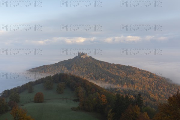 Hohenzollern Castle in a sea of fog at sunrise, autumn in the Swabian Jura