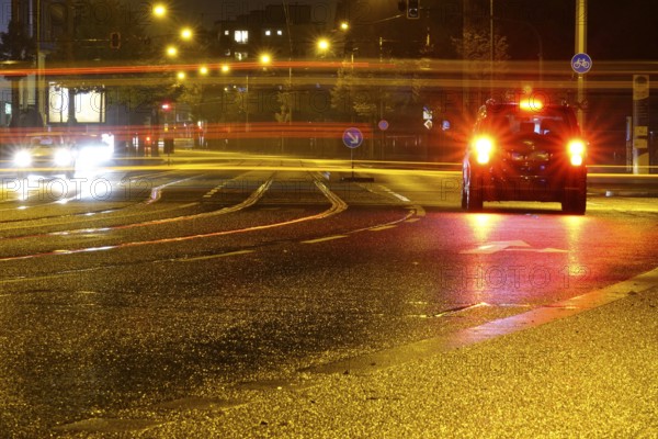 Road traffic at night and poor visibility in a city, autumn, Germany
