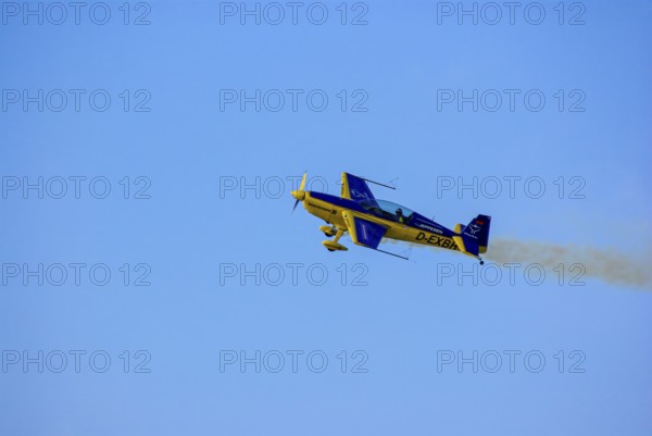 An Extra EA-300 of Extra Flugzeugproduktions- und Vertriebs GmbH with the registration D-EXBH during a flight demonstration as part of an air show at the Rossfeld in Metzingen-Glems, Baden-Württemberg, Germany, for editorial use only